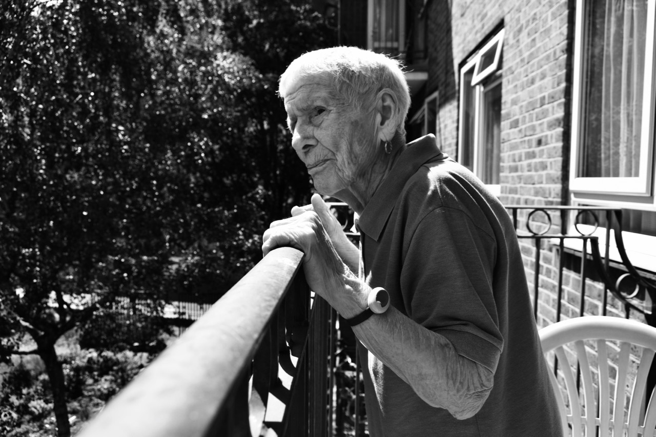 Nan looking over garden fence