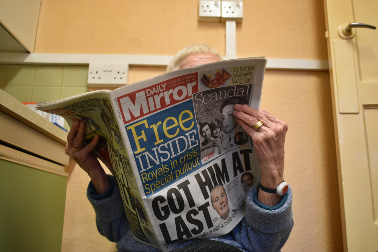 Nan reading newspaper