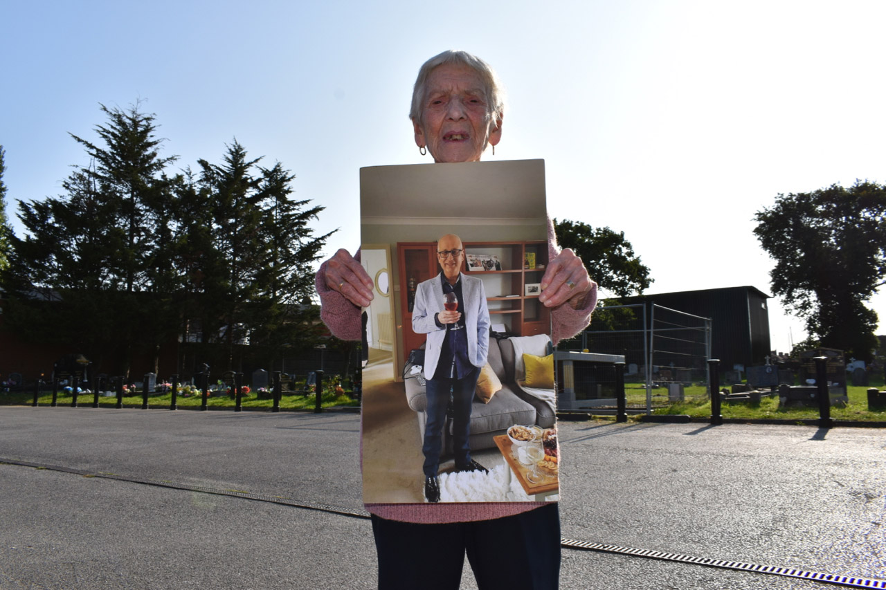 Nan holding picture of Dad