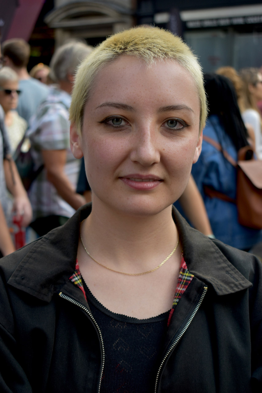 Woman with cropped blonde hair