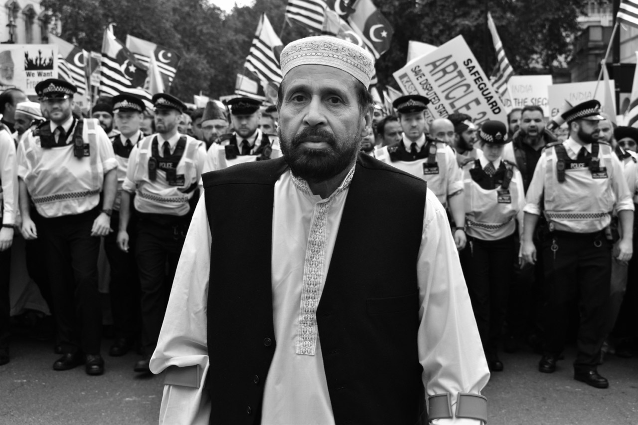 Protest Middle-Eastern man in front of police