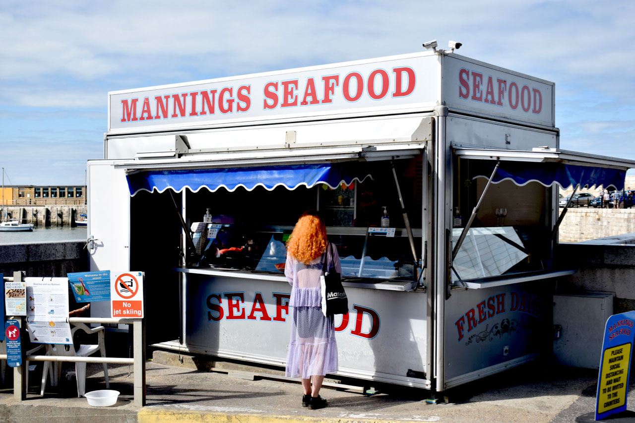 Image of Mannings Seafood stall at beach.